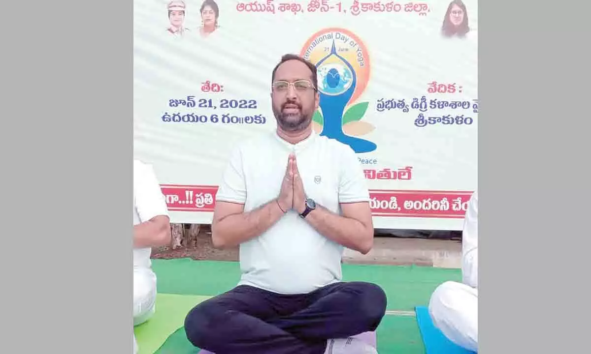 District Collector Srikesh B Lathakar practising yoga in Srikakulam on Tuesday