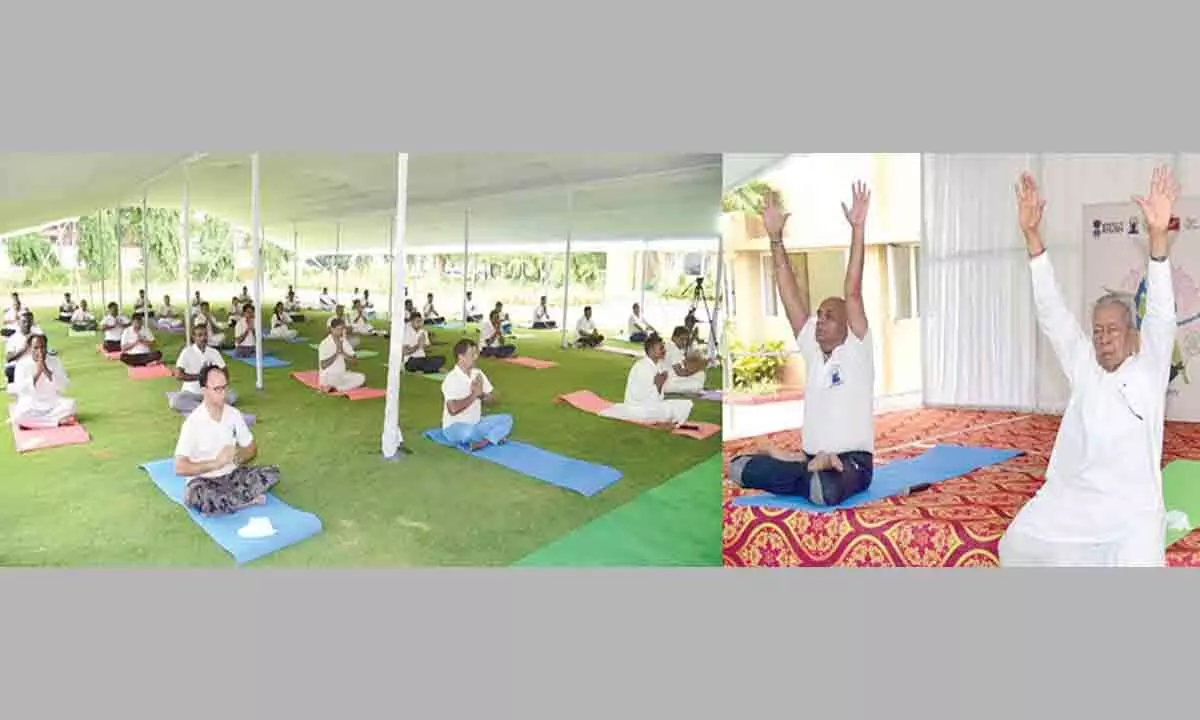 Governor Biswa Bhusan Harichandan practising yoga on eight International Yoga Day in Vijayawada on Tuesday
