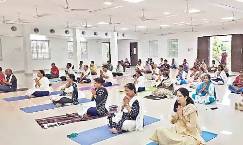 District Judge and Magistrate P Venkata Jyotirmayi and DLSA secretary K Pratyusha Kumari participating in International Yoga Day event at Ambedkar Community Hall in Rajamahendravaram on Tuesday