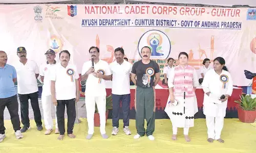 District Collector M Venugopala Reddy speaking at a programme on the International Yoga Day in Guntur on Tuesday