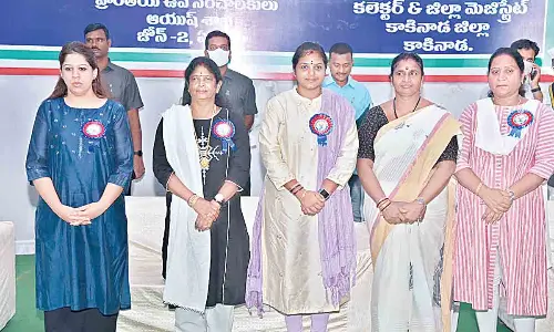 MP Vanga Geetha, District Collector Krithika Shukla, Kakinada Mayor Sunkara Siva Prasanna and others participating in International Yoga Day celebrations at RMC College in Kakinada on Tuesday