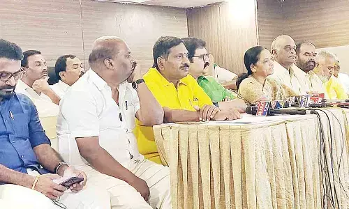 TDP national spokesperson K Pattabhiram speaking to the media in Tirupati on Tuesday. Party leaders G Narasimha Yadav, M Sugunamma and others are seen.