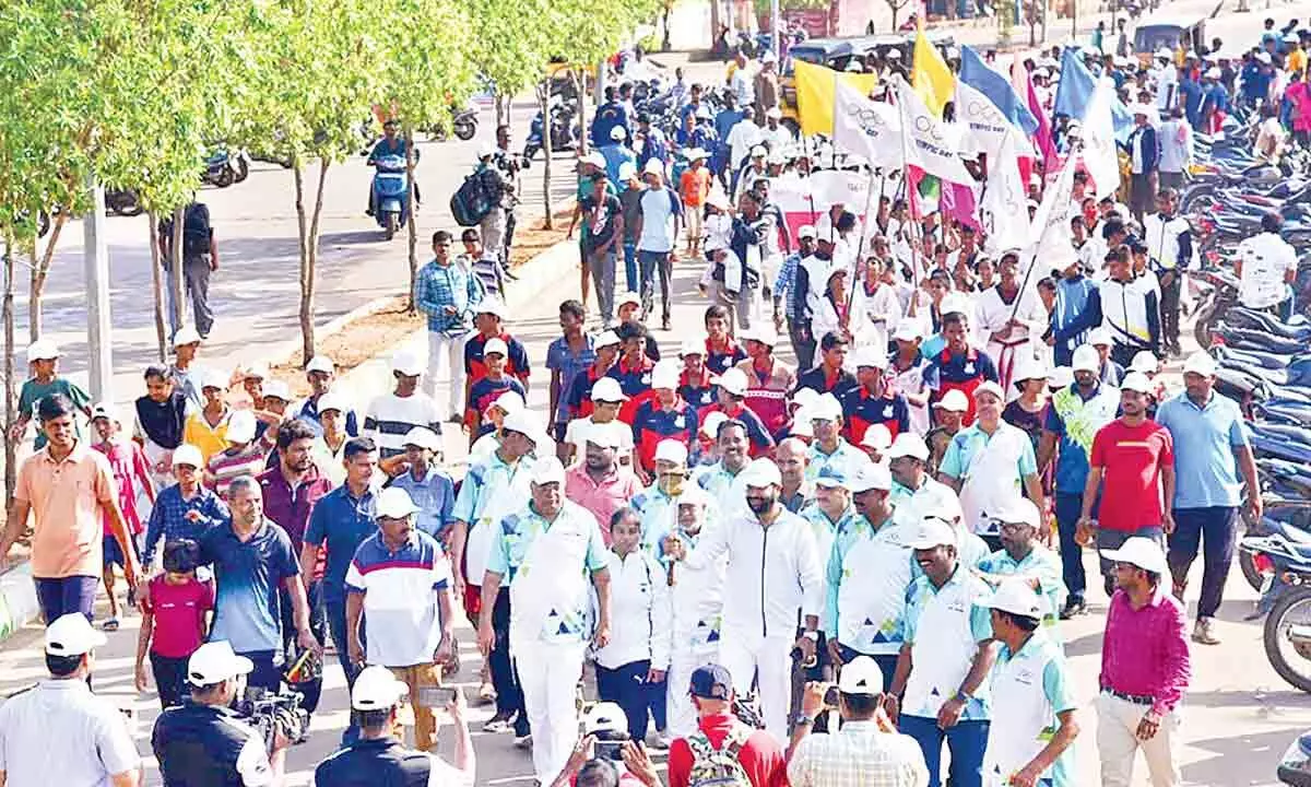 People participating in Olympic run in Vizianagaram on Thursday