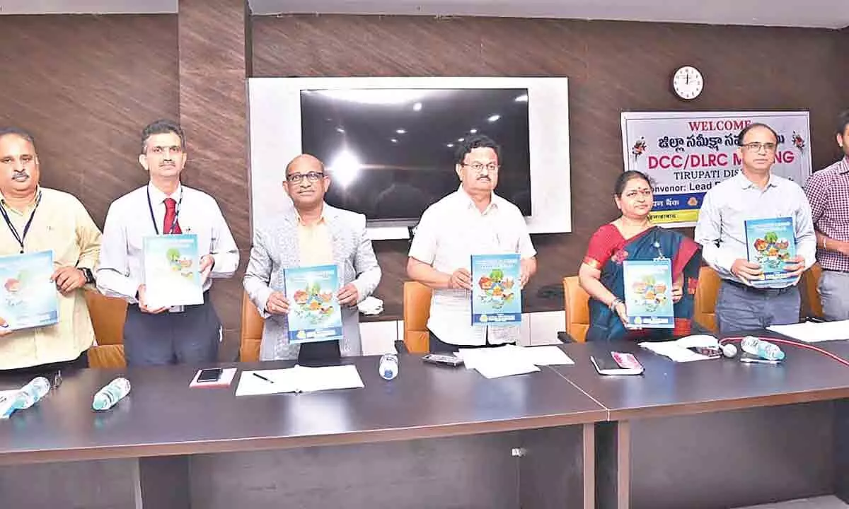 District Collector K Venkata Ramana Reddy and bankers releasing the annual credit plan booklet at the DCC/DLRC meeting on Friday