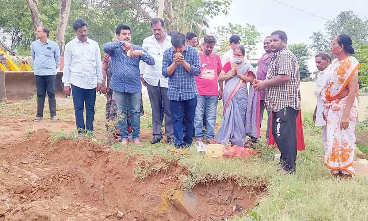 YSRCP Rajahmundry rural coordinator Chandana Nageswar performing bhumi puja for the construction of additional classrooms at GPR  ZP High School in Bommuru village on Friday