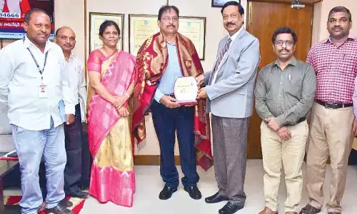 Adikavi Nannaya University Vice-Chancellor Prof M Jagannadha Rao presenting a memento to Ramesh Babu, chief program coordinator, Academy of Ham Radio, at a programme at the university on Friday
