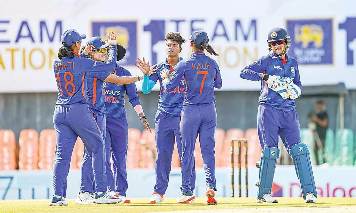 Indian bowler Pooja Vastrakar celebrates with teammates after the wicket of Sri Lankan batter Chamari Athapaththu, during the 2nd T20 at Rangiri Dambulla International Cricket Stadium, in Dambulla, Sri Lanka on Saturday