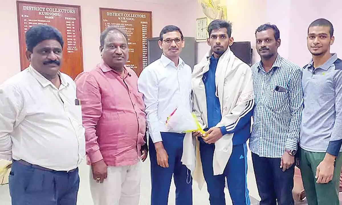 District Collector P Koteshwara Rao felicitating Shiva Kumar on the occasion of his selection to the Indian team to be played at Sepak Takraw Jeans World Cup Championship competitions to be held in Bangkok