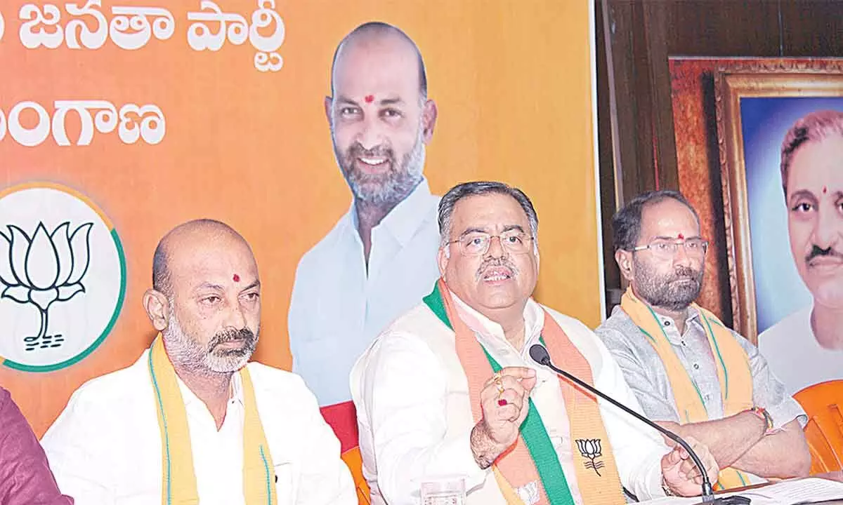 BJP national general secretary Tarun Chugh, Telangana State president Bandi Sanjay Kumar, and BJP national official spokesperson Sanjay Mayukh addressing the media in Hyderabad on Saturday