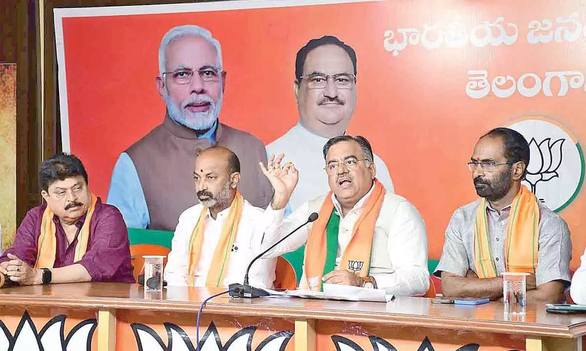 BJP national general secretary and Telangana State in-charge Tarun Chugh along with State unit president Bandi Sanjay Kumar addressing the media in Hyderabad on Saturday