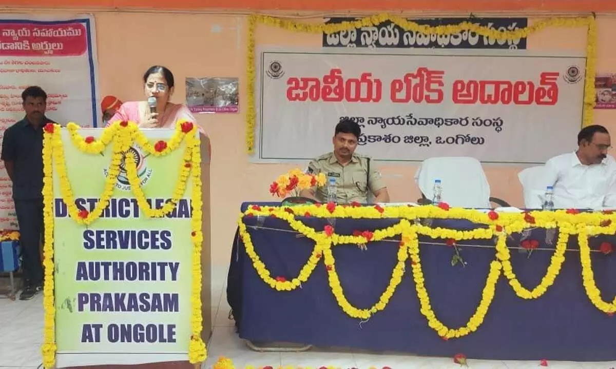 Prakasam district judge and DLSA chairperson A Bharathi speaking at the inaugural function of National Lok Adalat in Ongole on Sunday