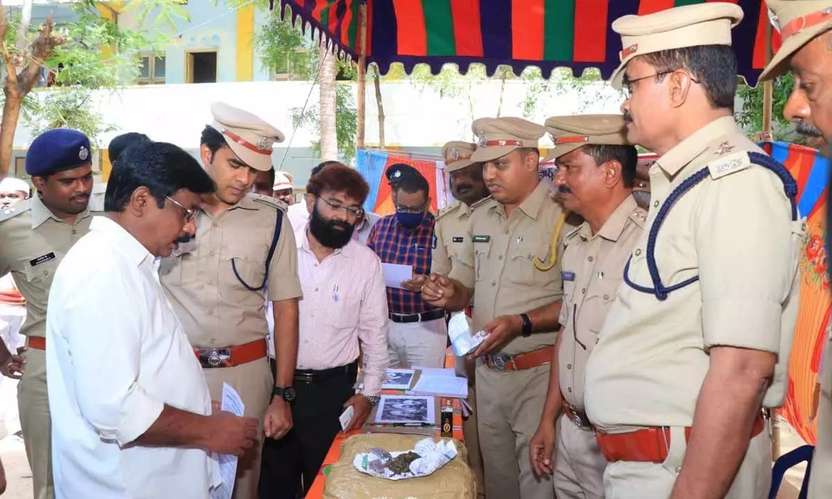District Judge  E Bhima Rao, SP  Y Rishanth Reddy  and others examining drugs displayed in Chittoor on Sunday