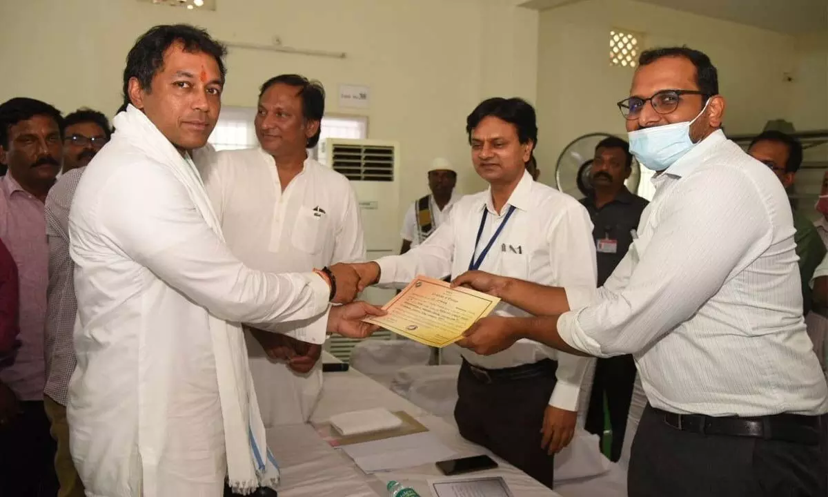 Victorious YSR Congress candidate Mekapati Vikram Reddy receiving the certificate of election from Returning Officer MN Harendhira Prasad in Atmakur on Sunday