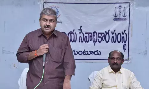 District Principal Judge and DLSA chairman YVSBG Pardha Saradhi addressing a meeting at DLCA building in Guntur on Sunday. District Judge and DLSA secretary K Ratnakar is also seen.