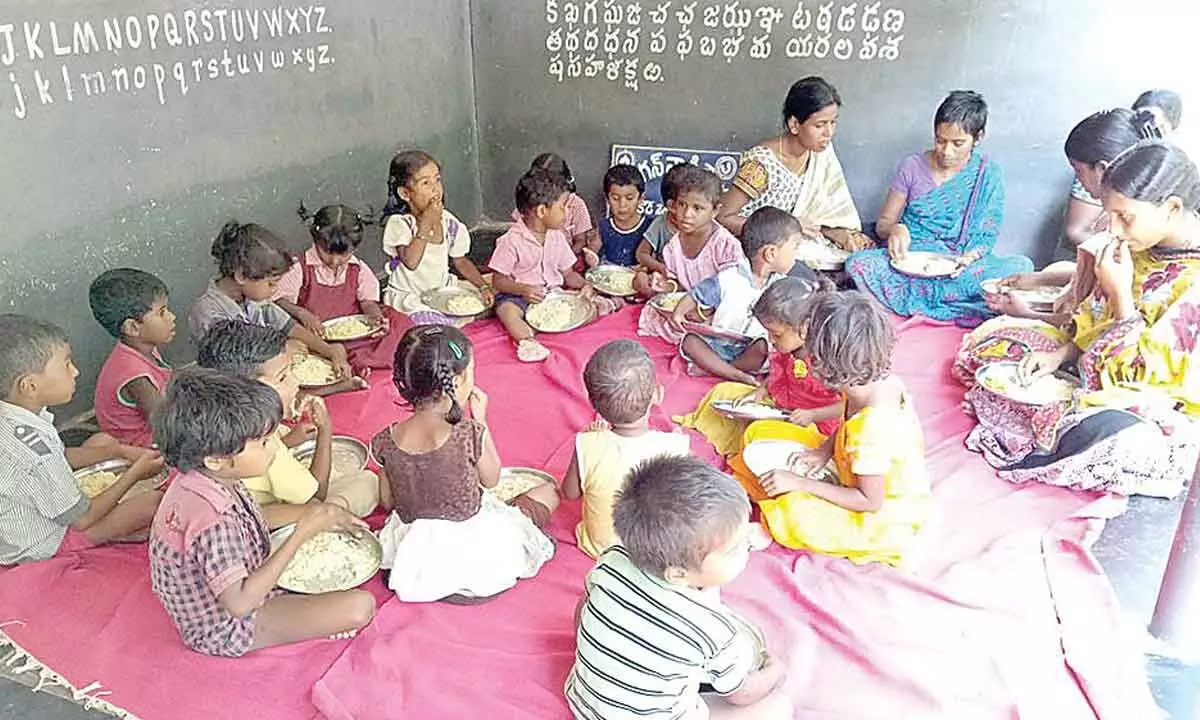 File photo of pregnant and lactating women having meal at an Anganwadi centre in Kanigiri