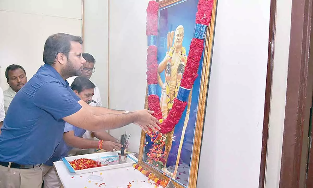 Joint Collector Kethan Garg garlanding the portrait of Alluri Sitharama Raju to mark his birth anniversary celebrations at the Collectorate in Anantapur on Monday