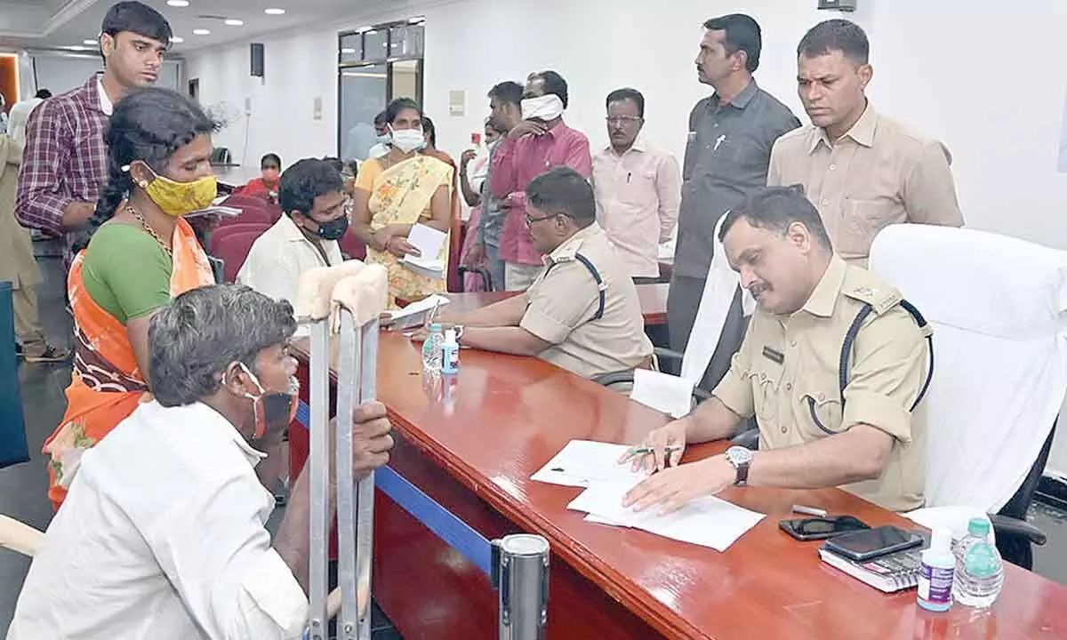 Superintendent of Police Kaginelli Fakeerappa receiving petitions from people in Anantapur on Monday