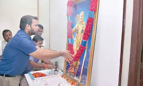 Joint Collector Kethan Garg garlanding the portrait of Alluri Sitharama Raju to mark his birth anniversary celebrations at the Collectorate in Anantapur on Monday
