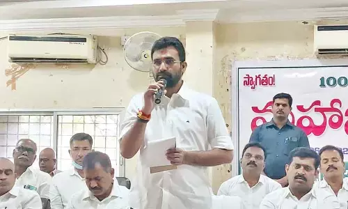 NDCCB chairman Pocharam Bhaskar Reddy addressing the general body meeting of the bank in Nizamabad on Monday
