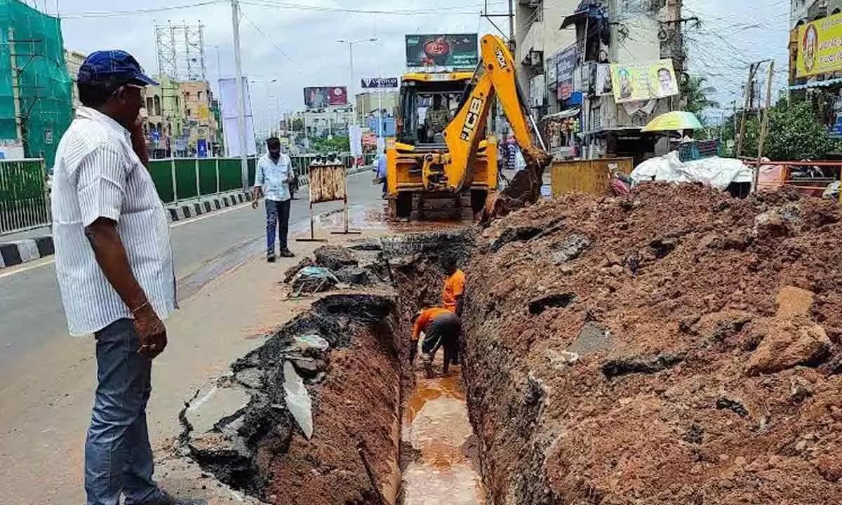 Corporation officials carrying out pipeline repair works at Gopalapatnam in Visakhapatnam