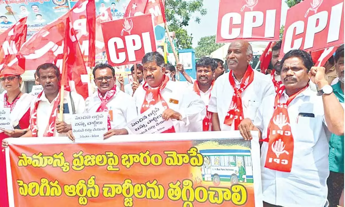 CPM and CPI leaders staging dharna against bus fare hike at RTC bus depot in Tirupati on Saturday.