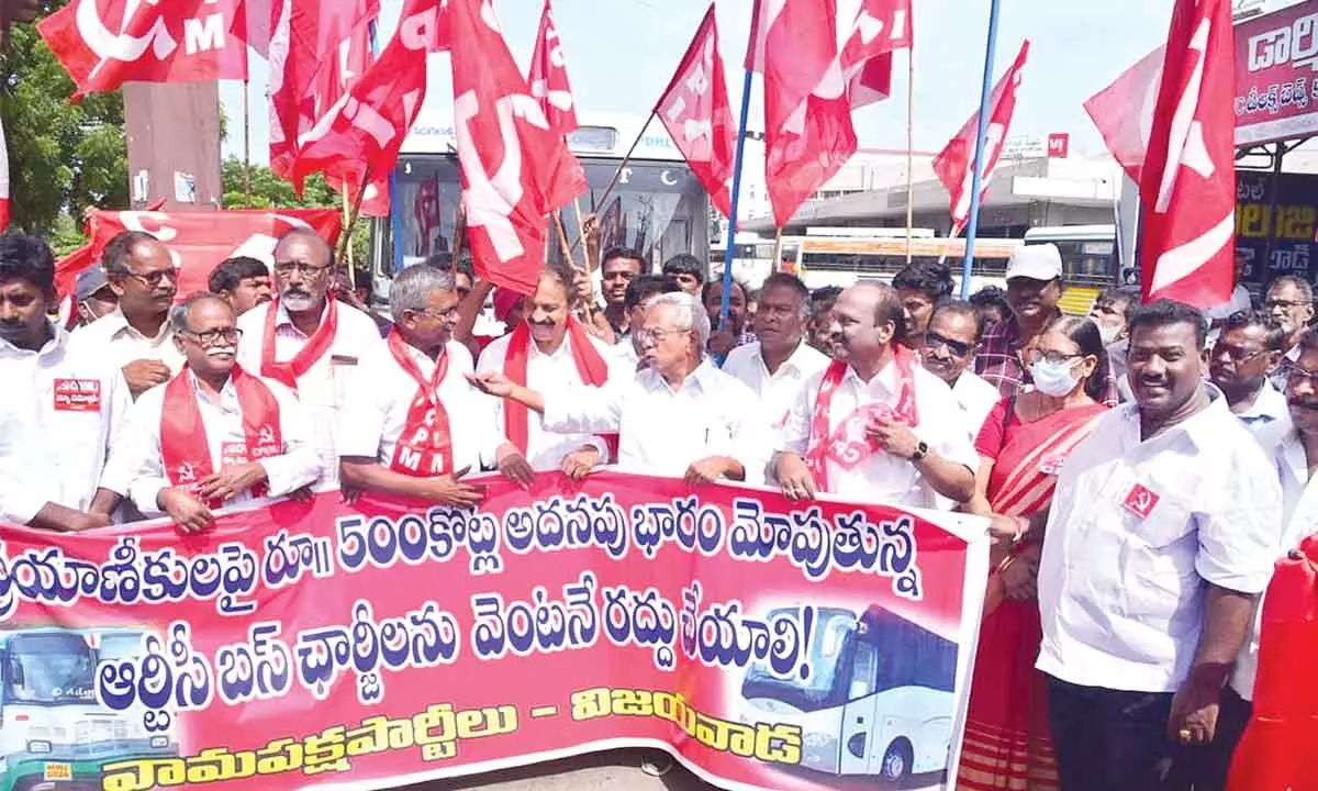 Left party leaders stage a protest against increased bus fares near Pandit Nehru Bus Station in Vijayawada on Saturday