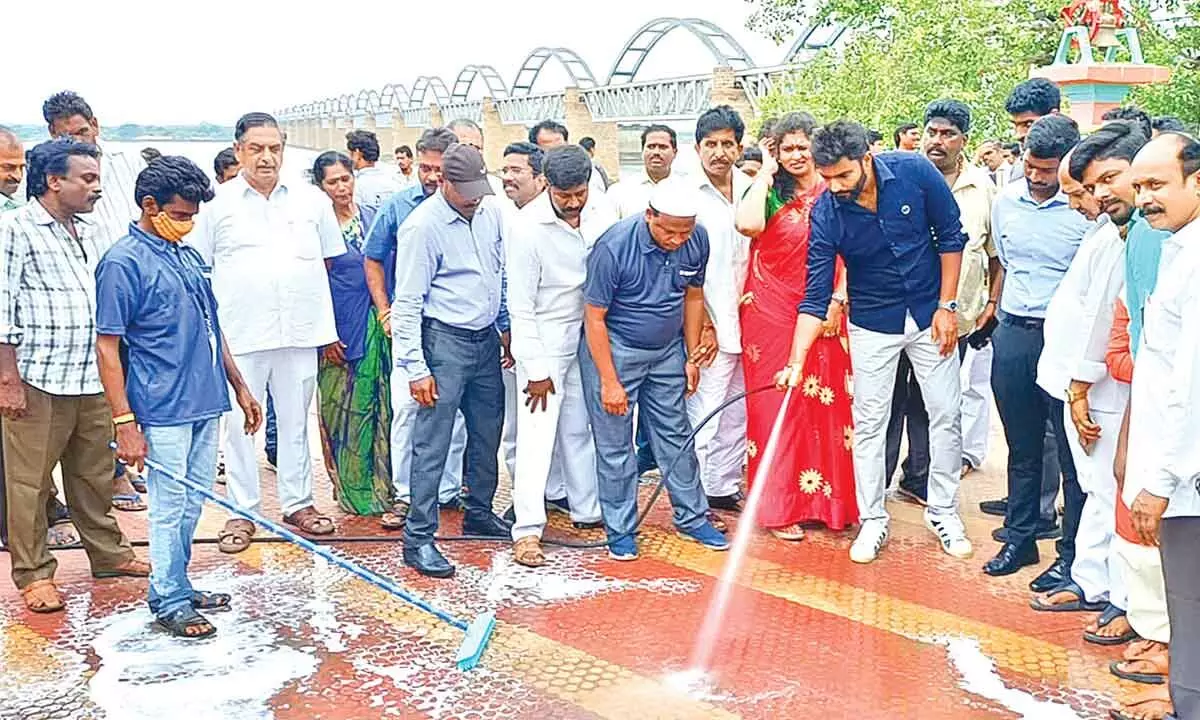 MP Margani Bharat Ram launching the cleaning programme of Godavari ghats under the auspices of a private agency at Pushkar Ghat in Rajamahendravaram on Saturday