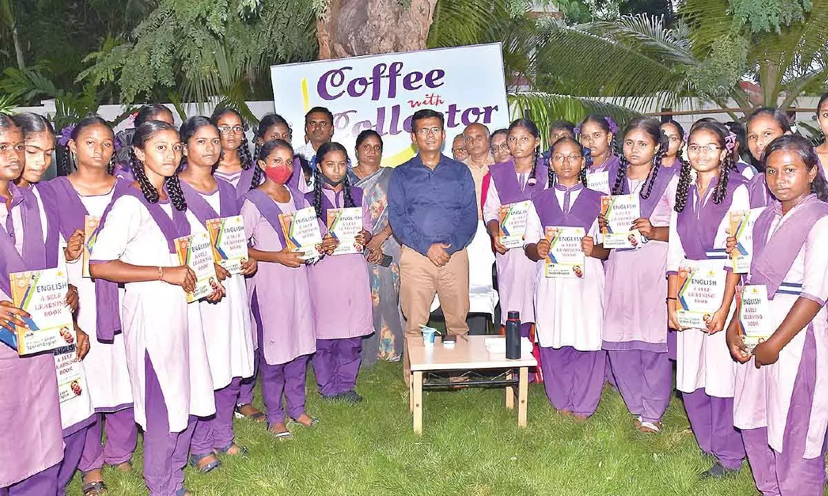 Prakasam Collector A S Dinesh Kumar with the students who met him as part of ‘Coffee with Collector’ programme at his residence in Ongole on Saturday