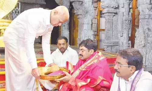 TTD EO A V Dharma Reddy offering Srivari Theertha Prasadams to DRDO Chairman  G Satheesh Reddy in Tirumala temple on Friday