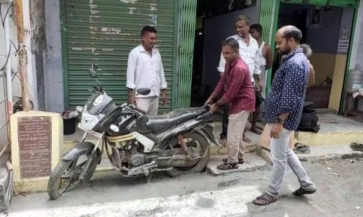 Man From Tamil Nadu Got Shocked To See His Bike Stuck In Laid Concrete