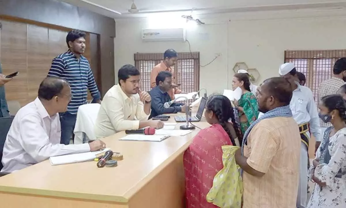 ITDA Project Officer Suraj Ganore, Rampachodavaram Sub-Collector Simhachalam and other officials receiving petitions from  people at ITDA Hall  in Rampachodavaram on Monday