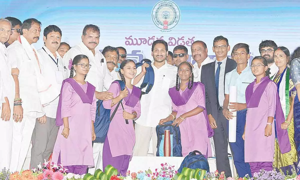 Chief Minister Y S Jagan Mohan Reddy launches distribution of Jagananna Vidya Kanuka kits to students at Adoni in Kurnool district on Tuesday