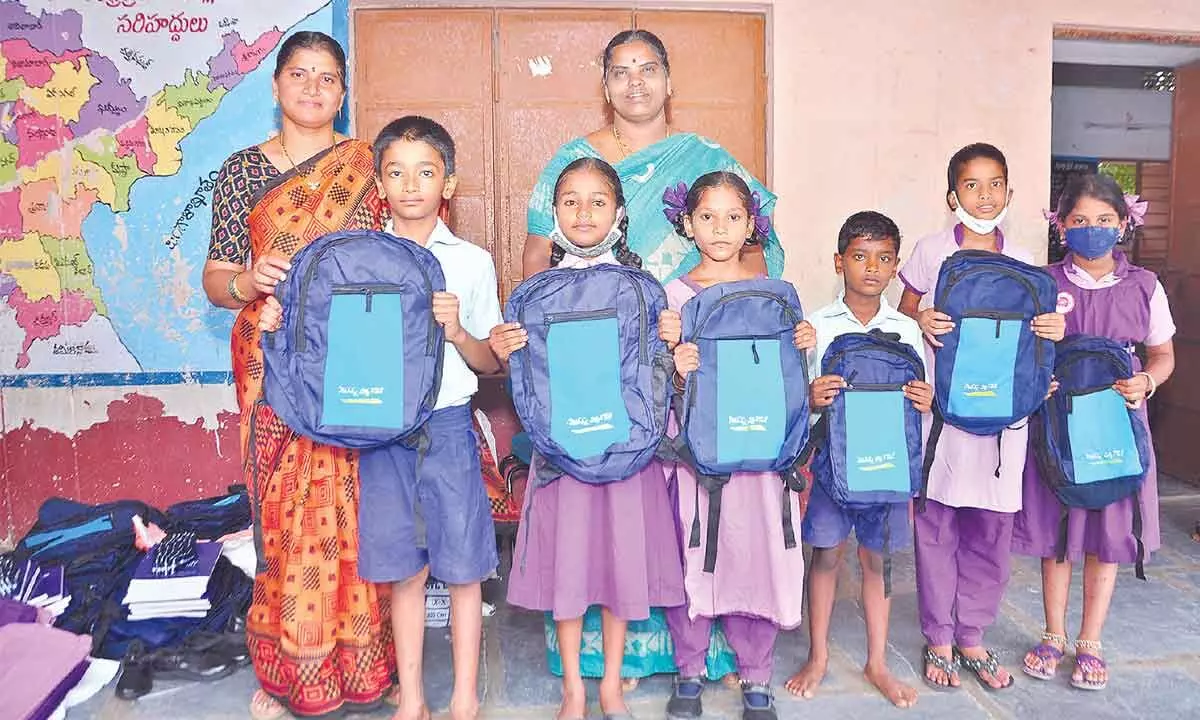 Jagananna Vidya Kanuka kits distributed to the students at a Municipal Corporation Primary School in Guntur on Tuesday