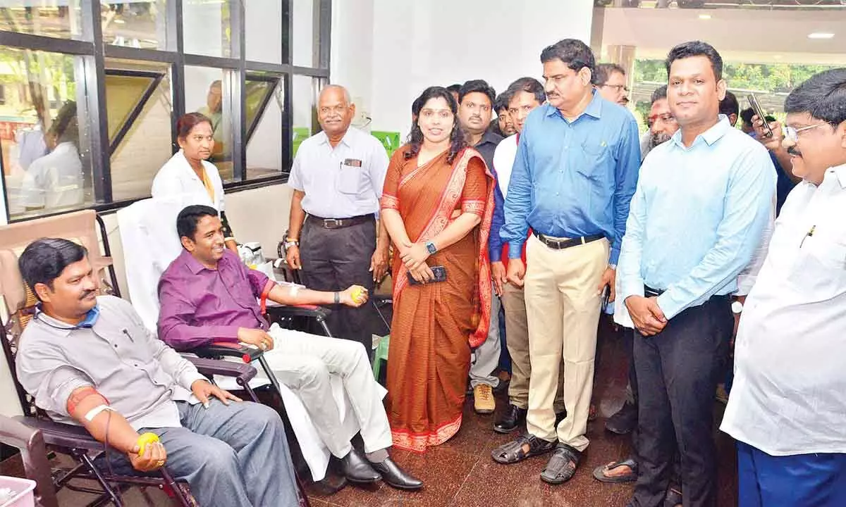 Greater Visakhapatnam Municipal Commissioner G Lakshmisha donating  blood in Visakhapatnam on Tuesday