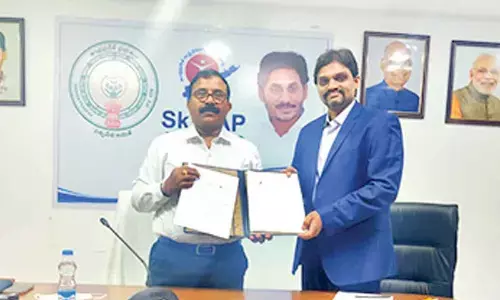 APSSDC MD and CEO S Satyanarayana with Saadhana Technology Solutions director Madan Kaza showing MoU at APSSDC office at Tadepalli on Tuesday