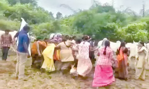 Tribal farmers clashing with forest officials in Chowdaram village under Penuballi mandal in Khammam district on Tuesday