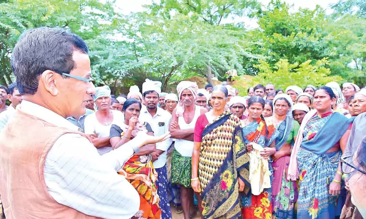 District Collector Basanth Kumar interacting with NREGS workers in Kothacheruvu on Wednesday.