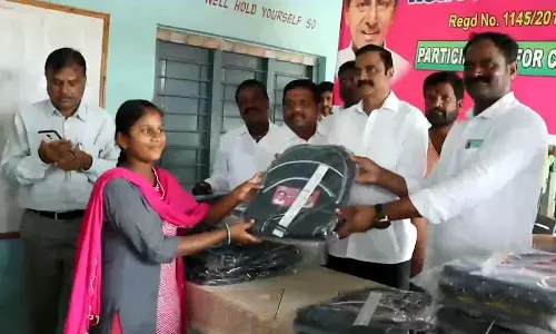 Dr K Chandrashekar Reddy distributes stationery to girl students under KCR Foundation