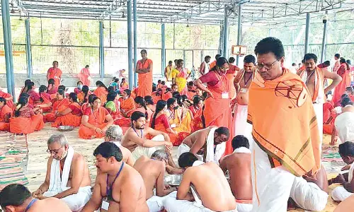 Temple Executive Officer S Lavanna monitoring the counting of hundi collections in Srisailam on Wednesday.