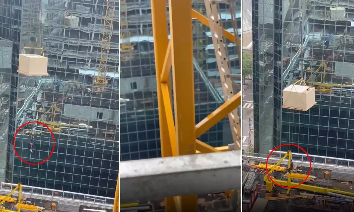 Watch The Trending Video Of A Worker Hanging From Crane