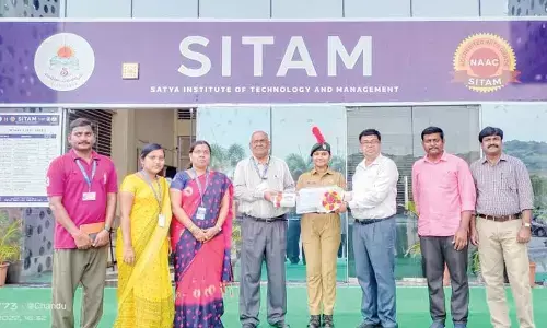 K Trishitha with SITAM College management in Vizianagaram