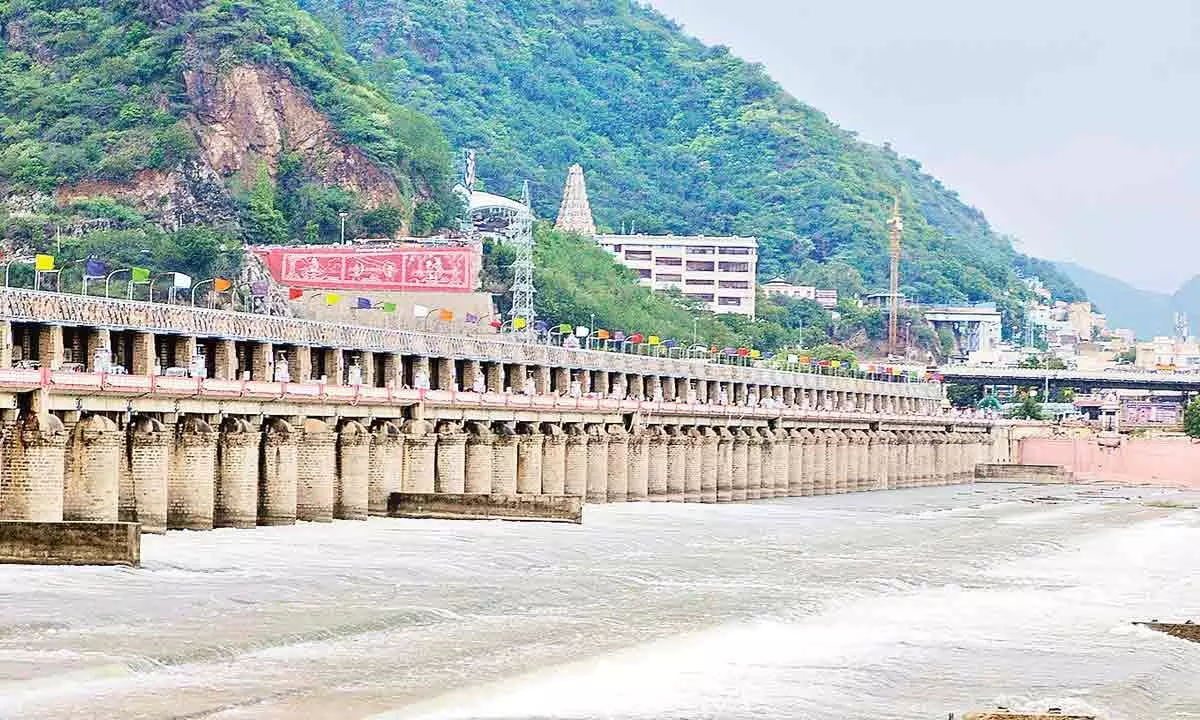 Eight gates of Prakasam barrage in Vijayawada lifted as floodwater inflow increases on Saturday  	( Hans photo Ch Venkata Mastan )