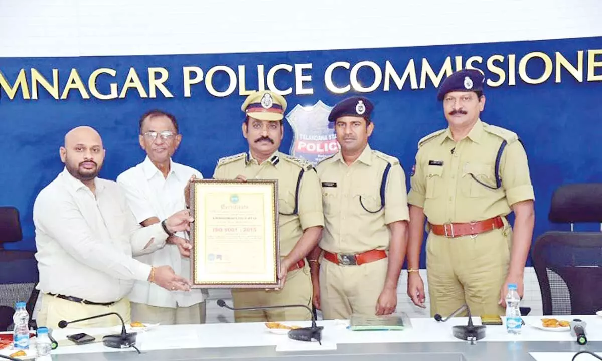 ISO representatives handing over the ISO 9001 certificate to Commissioner of Police V Satyanarayana in Karimnagar on Saturday