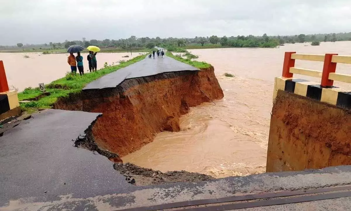 A breached road at Peddampet village in Mahadevapur mandal of Bhupalapalli district on Sunday.  Photo: G Shyam Kumar