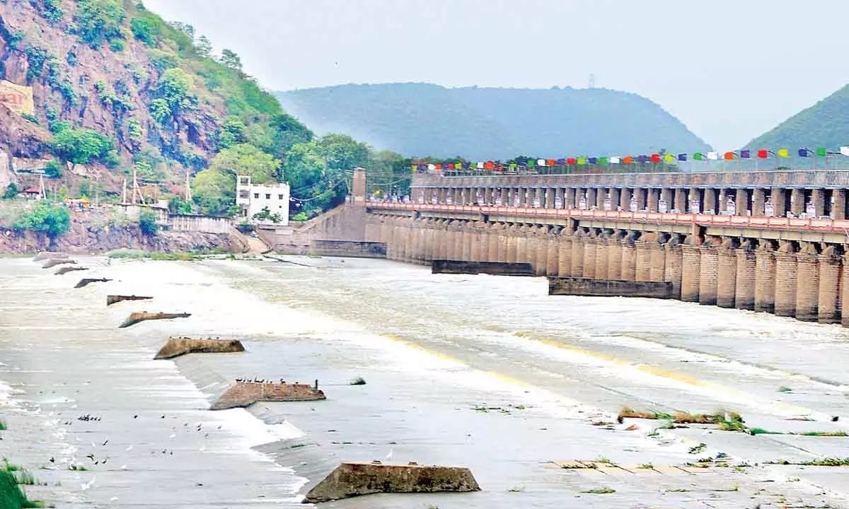 Floodwater released at Prakasam Barrage in Vijayawada on Sunday. Photo: Ch Venkata Mastan