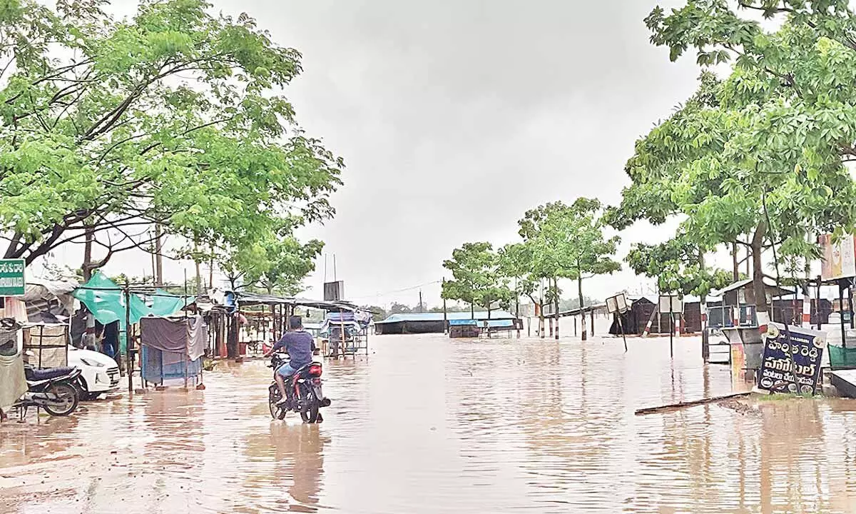 The main road of Medaram Sammakka Sarlamma flooded with rainwater in Tadwai mandal of Mulugu district on Monday 	Photo: Shyam Kumar