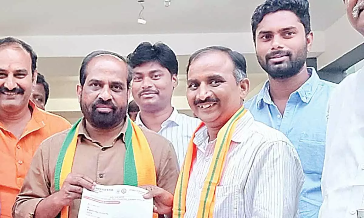BJP national secretary Y Satyakumar giving the appointment letter to YV Subbarao in Guntur on Monday
