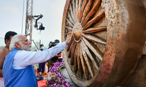 Prime Minister Narendra Modi during the unveiling ceremony of a bronze national emblem at new Parliament building, in New Delhi, Monday