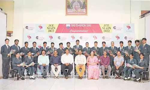 Sri Shirdi Sai Junior College chairman T Sridhar, director Srividya, principal Mangaraju and others congratulating the students, who achieved the best results in JEE Mains in Rajamahendravaram on Monday