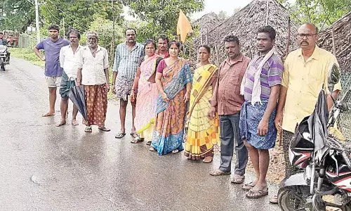 Flood victims of  Gannavaram and Yetapaka mandals waiting for transport to reach safer places on Monday